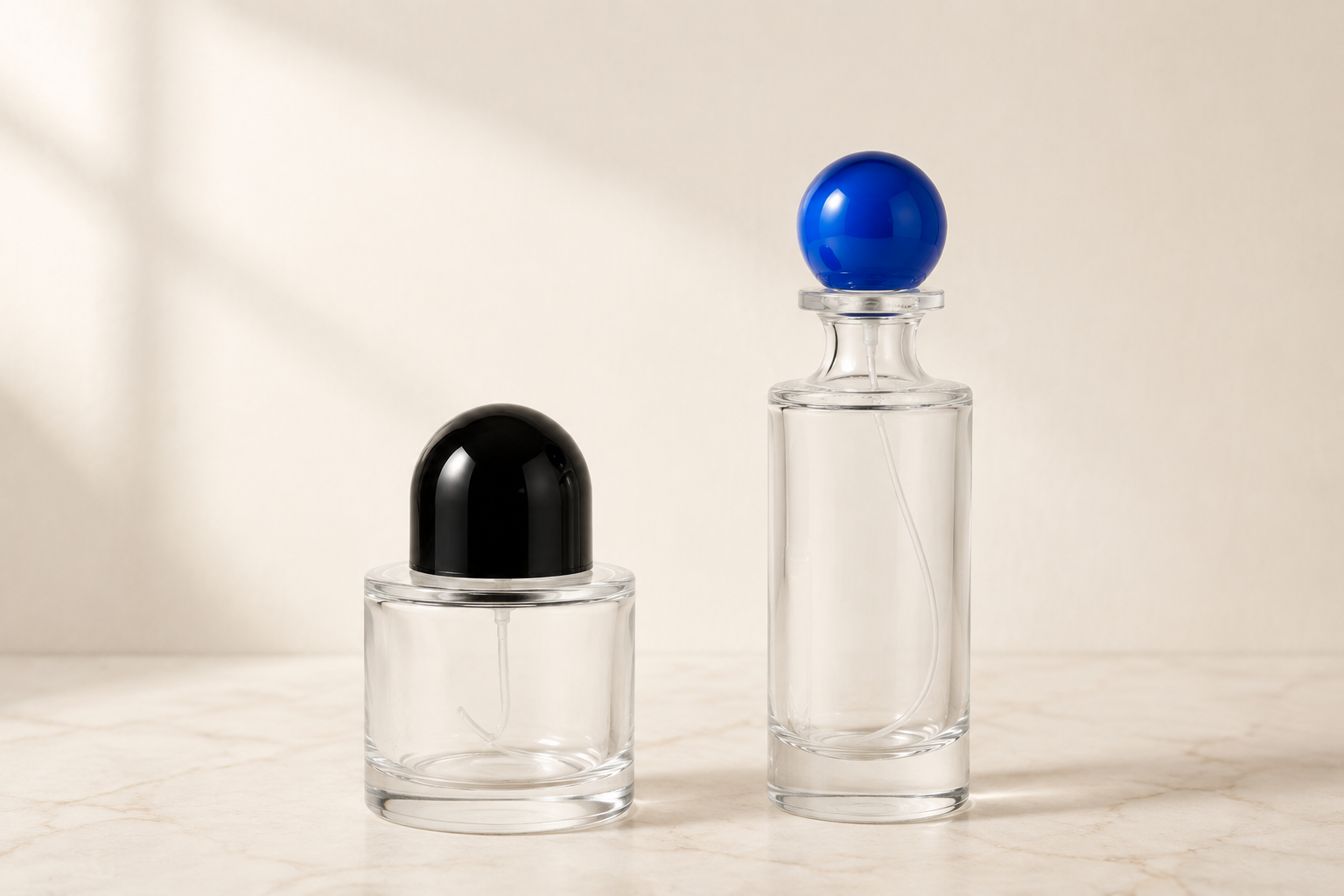 Round and cylindrical perfume bottles